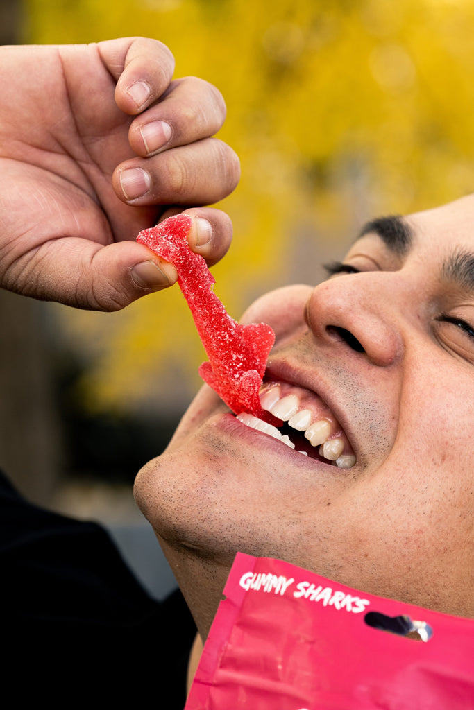 A men eating HHC Gummies